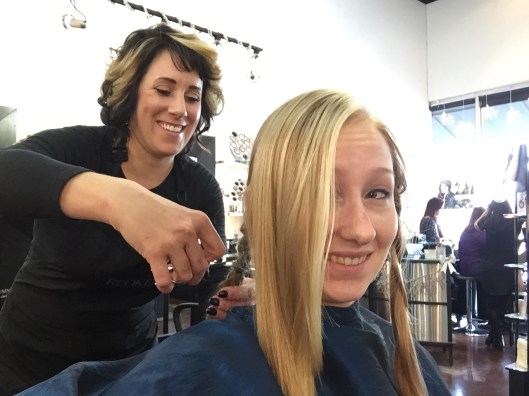 The moment of truth--chopping off my ponytail to give to Pantene Beautiful Lengths for women with cancer. 